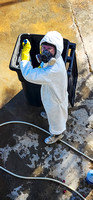 Liam cleaning the garbage can